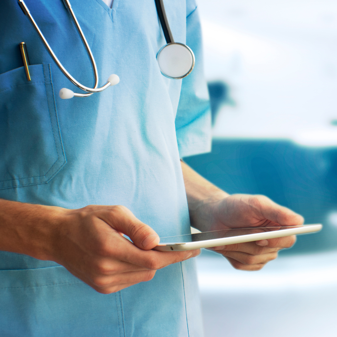 A doctor holding a tablet